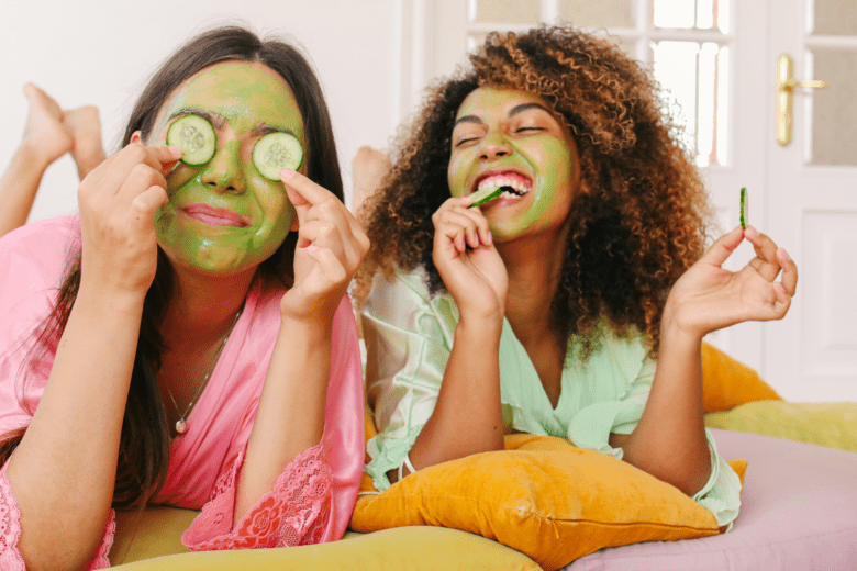 Two women doing face masks as self-care